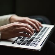 Woman's hands on laptop keyboard