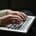 Woman's hands on laptop keyboard